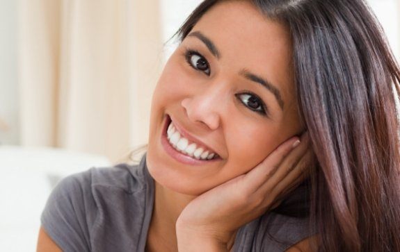 Woman sharing bright smile after teeth whitening