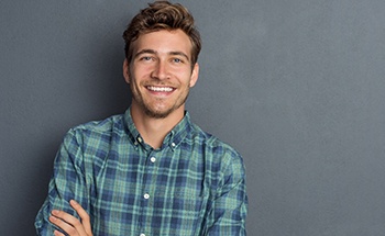 man smiling about dental implant post-op instructions in Goodyear