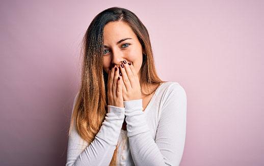 a woman smiling about Invisalign in Goodyear