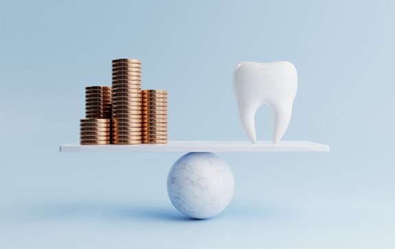 : A pile of coins and a giant tooth on a balancing scale