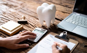  A person filling out a dental insurance form 