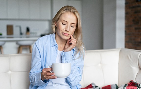 Woman with a sore tooth