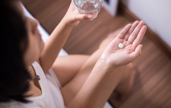 Dental patient taking oral conscious dental sedation pill