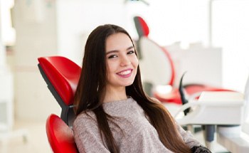 woman smiling about the cost of veneers in Goodyear