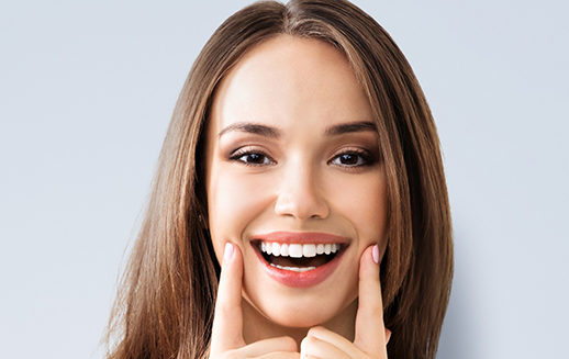 woman smiling with her veneers in Goodyear