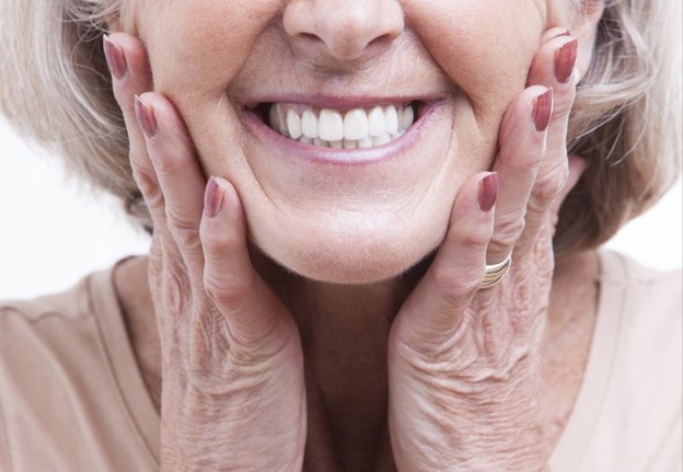 person showing off teeth after professional whitening treatment